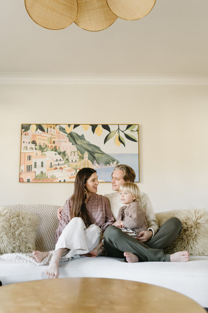 A loving family of three spending time together in their Portland home during an in-home session.
