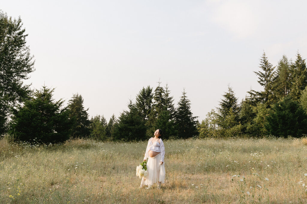 a couple posing for their maternity photos in oregon
