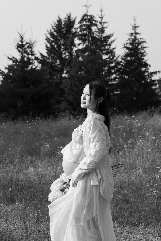 a couple posing for their maternity photos in oregon
