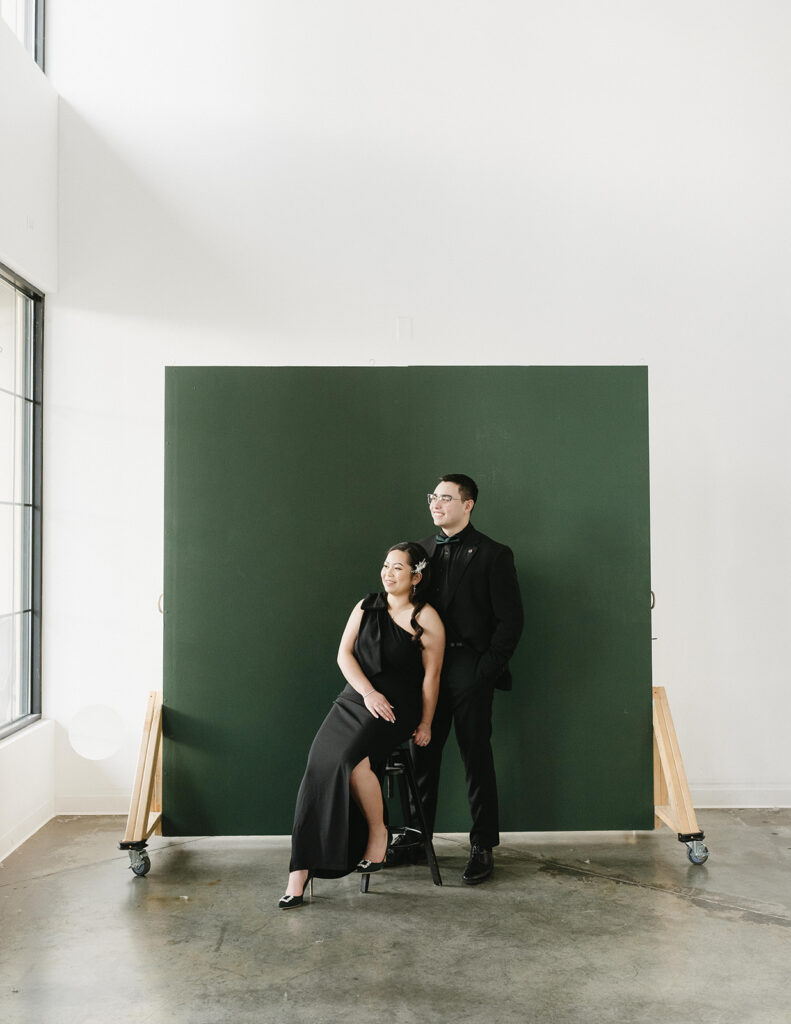 A couple posing in a studio in Washington for elegant and classic pre-wedding photos.
