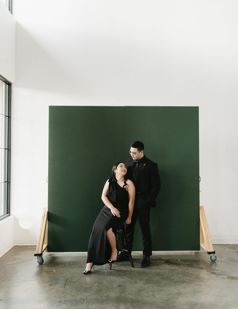 A couple posing in a studio in Washington for elegant and classic pre-wedding photos.
