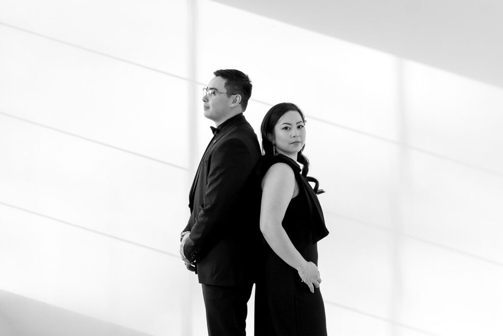 A couple posing in a studio in Washington for elegant and classic pre-wedding photos.
