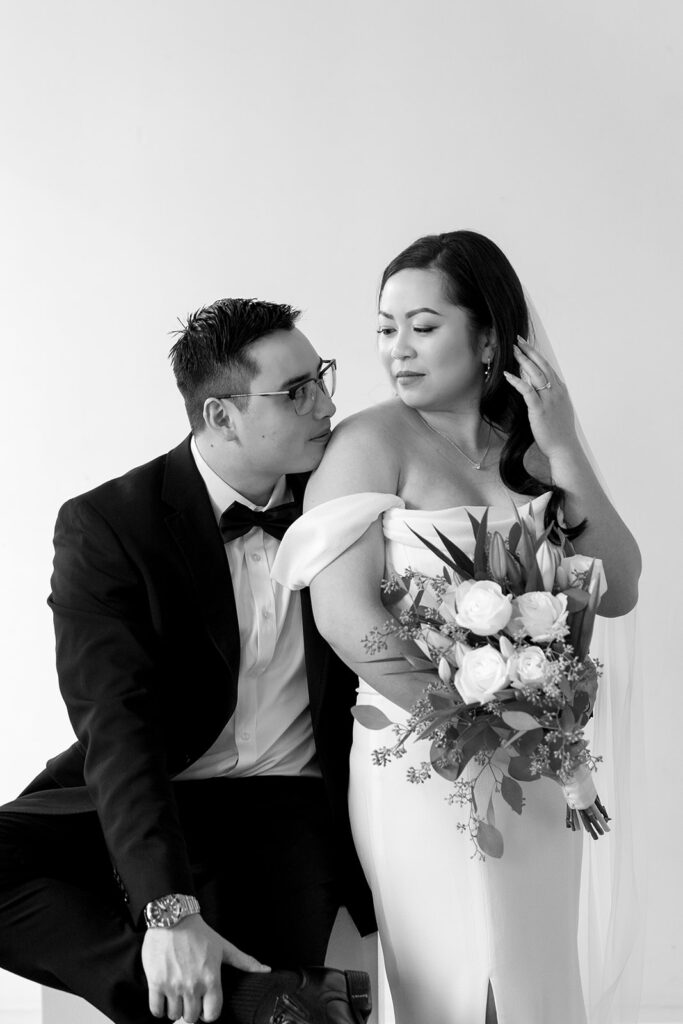 A couple posing in a studio in Washington for elegant and classic pre-wedding photos.
