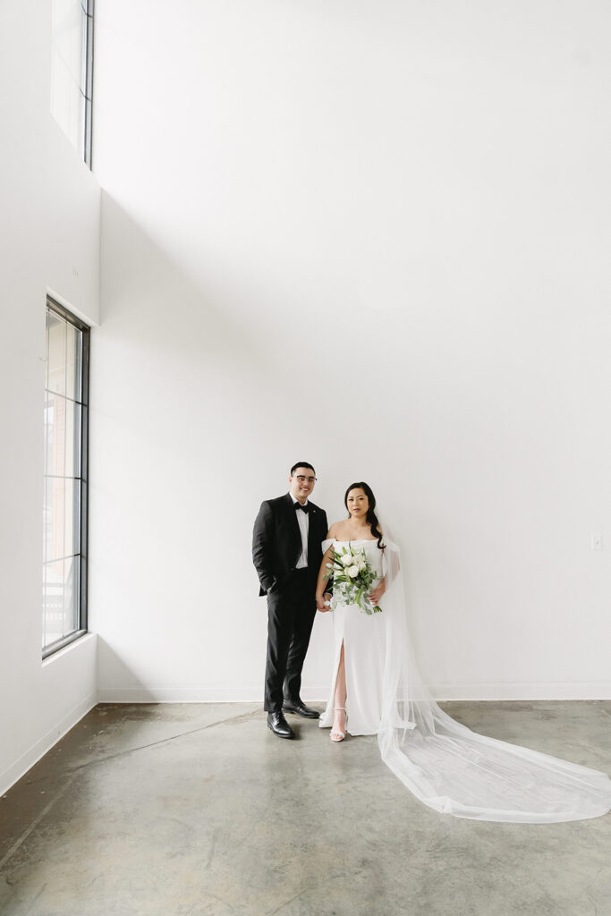 A couple posing in a studio in Washington for elegant and classic pre-wedding photos.
