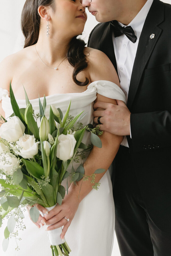 A couple sharing sweet moments during their pre-wedding photo session in a Washington studio.
