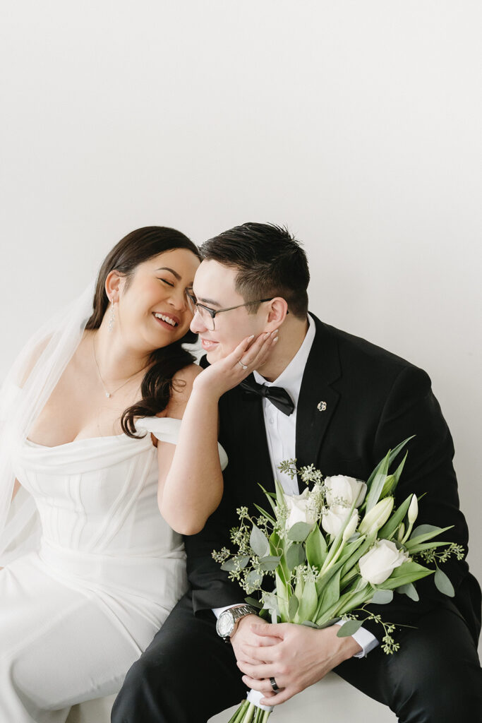 A couple sharing sweet moments during their pre-wedding photo session in a Washington studio.
