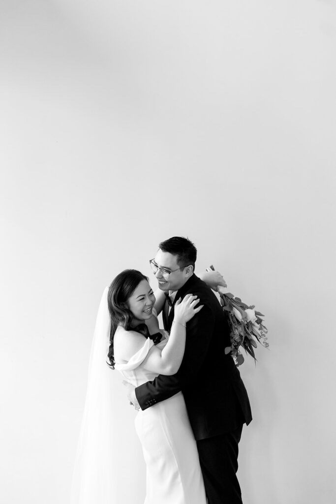 A couple sharing sweet moments during their pre-wedding photo session in a Washington studio.
