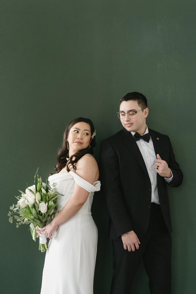 A bride and groom-to-be posing for simple and classic engagement photos in a Washington studio.
