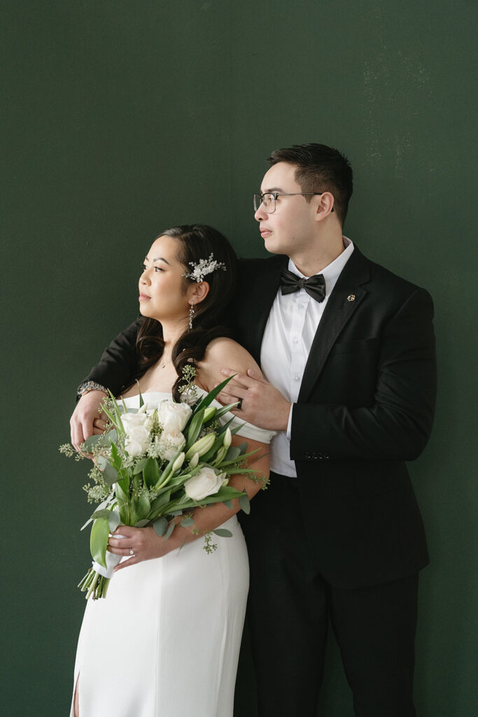 A couple posing in a studio in Washington for elegant and classic pre-wedding photos.
