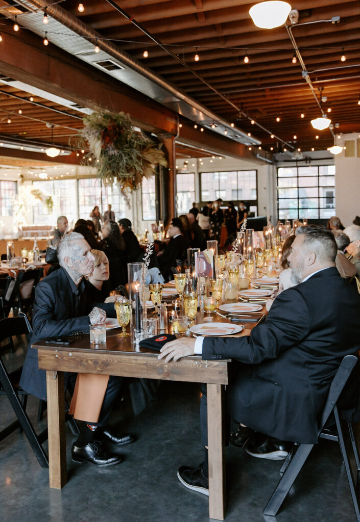 photo of guests sitting at dinner tables during celebration