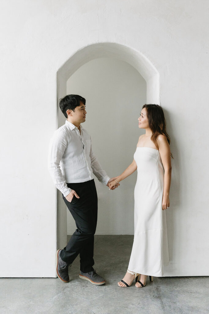 a couple posing for their romantic engagement photos
