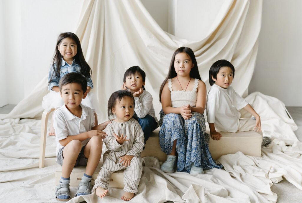 Happy family smiling during a professional session.
