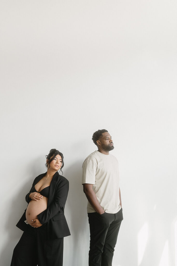 Studio maternity photo of expecting mother with soft draping and neutral tones-aesthetic maternity shoot
