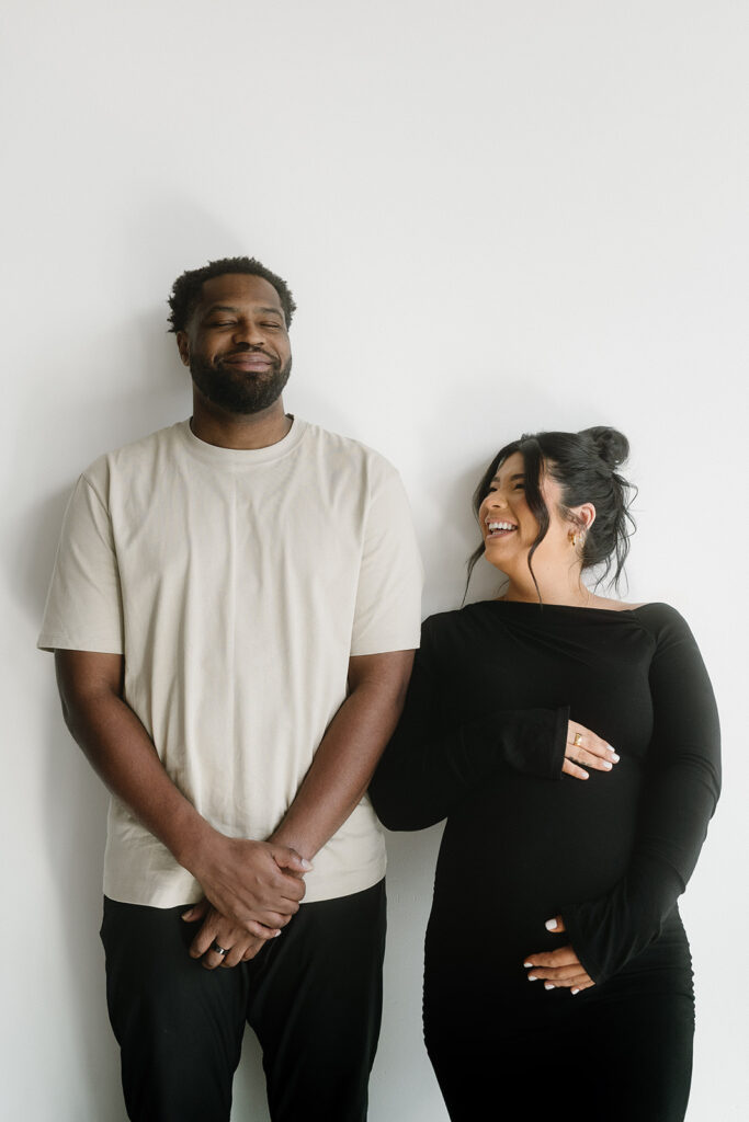 Couple posing together during an intimate maternity session

