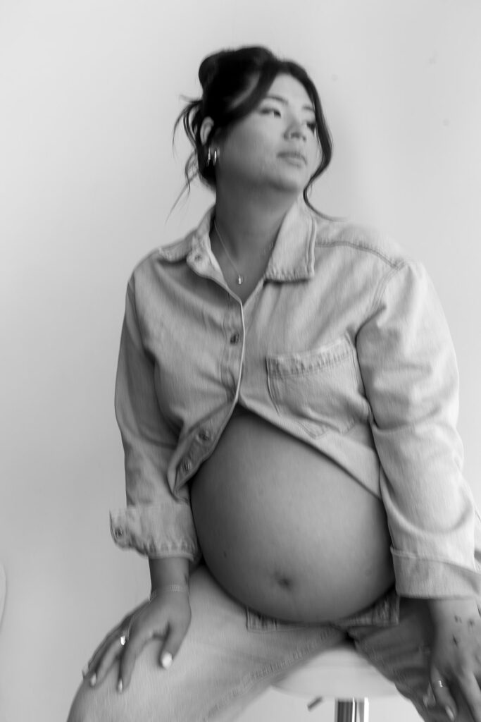 Studio maternity photo of expecting mother with soft draping and neutral tones-aesthetic maternity shoot
