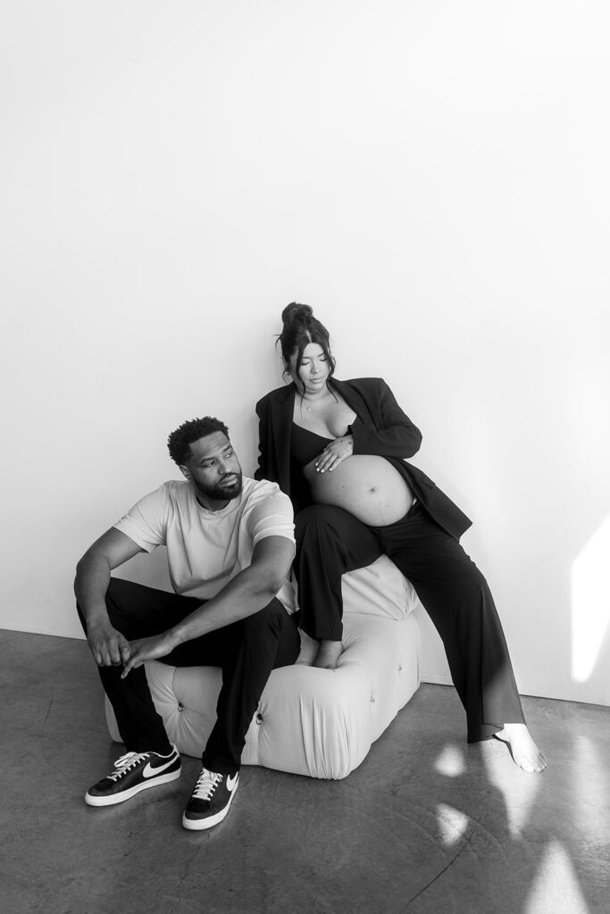 Couple posing together during an intimate maternity session
