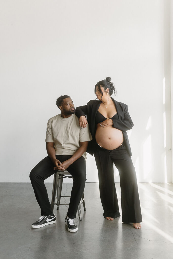 Couple posing together during an intimate maternity session

