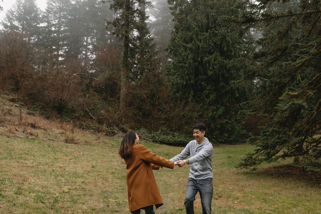 couple posing for engagement photos at hoyt arboretum
