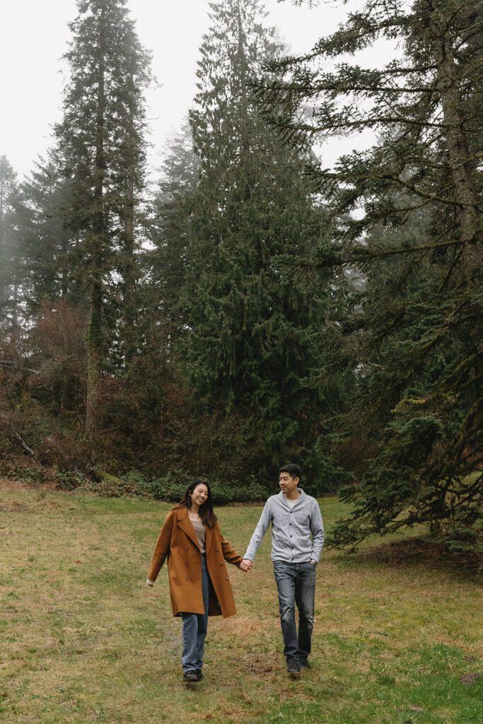 couple posing for engagement photos at hoyt arboretum
