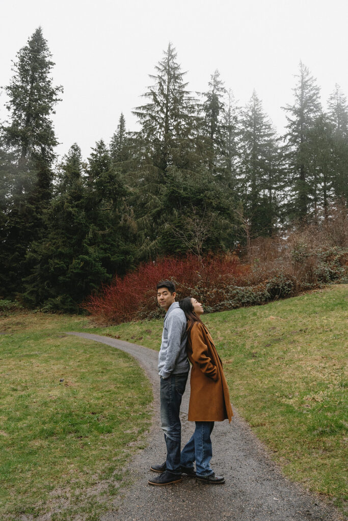 couple posing for engagement photos at hoyt arboretum
