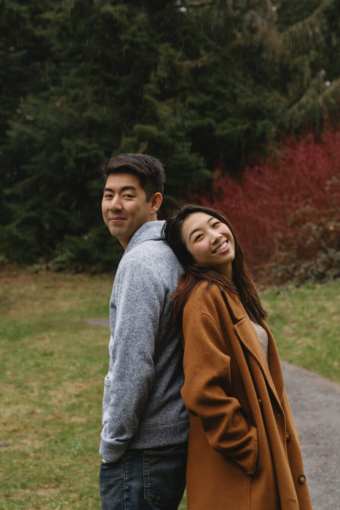couple posing for engagement photos at hoyt arboretum
