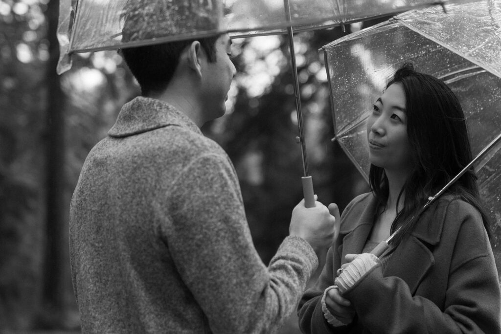couple posing for engagement photos at hoyt arboretum
