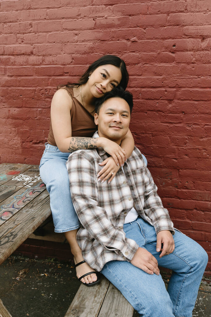 A candid moment captured during a casual engagement photo session.
