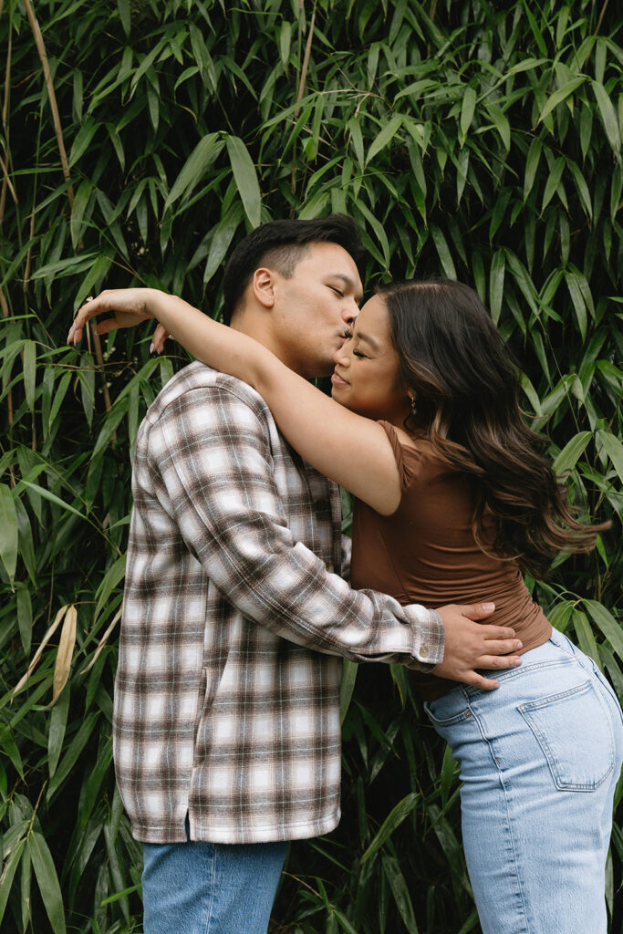 A candid moment captured during a casual engagement photo session.
