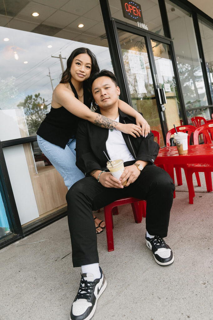 A candid moment captured during a casual engagement photo session.
