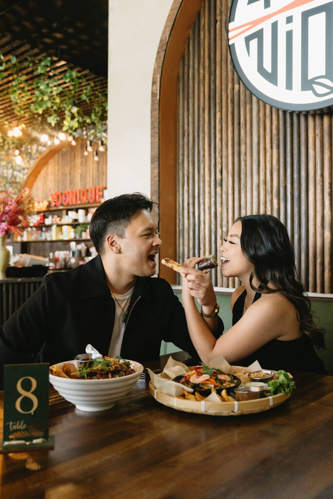A candid moment captured during a casual engagement photo session.
