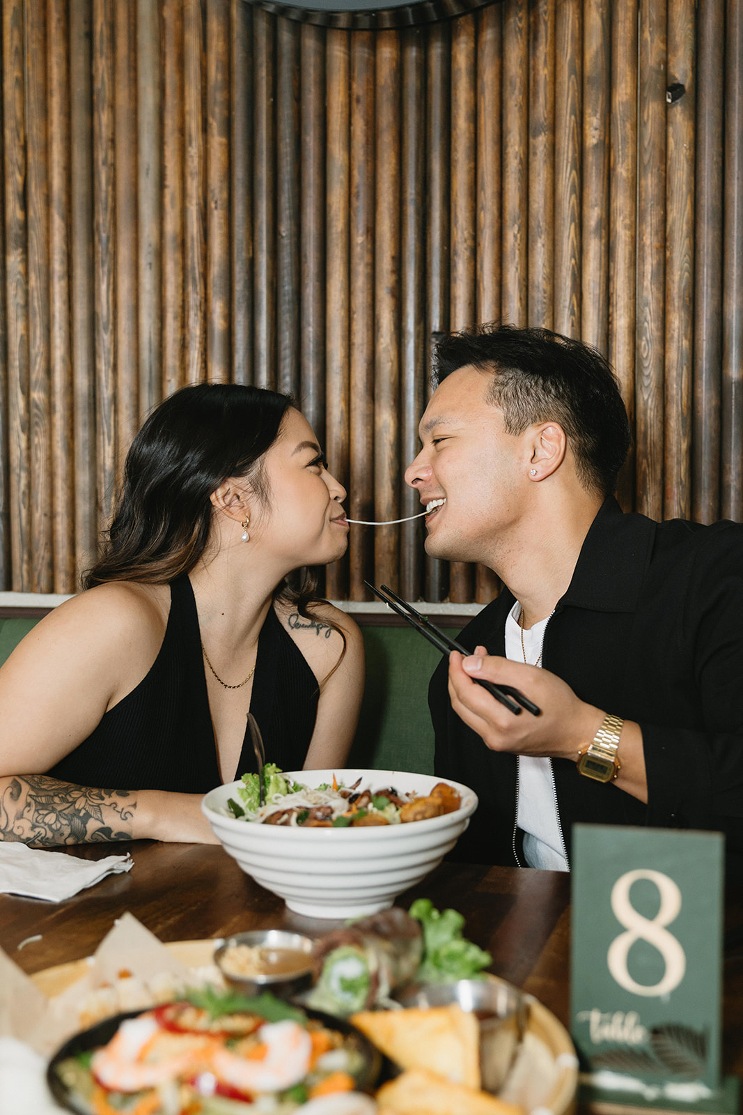 A candid moment captured during a casual engagement photo session.