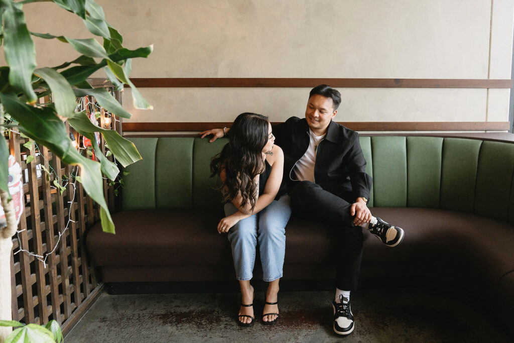 A candid moment captured during a casual engagement photo session.
