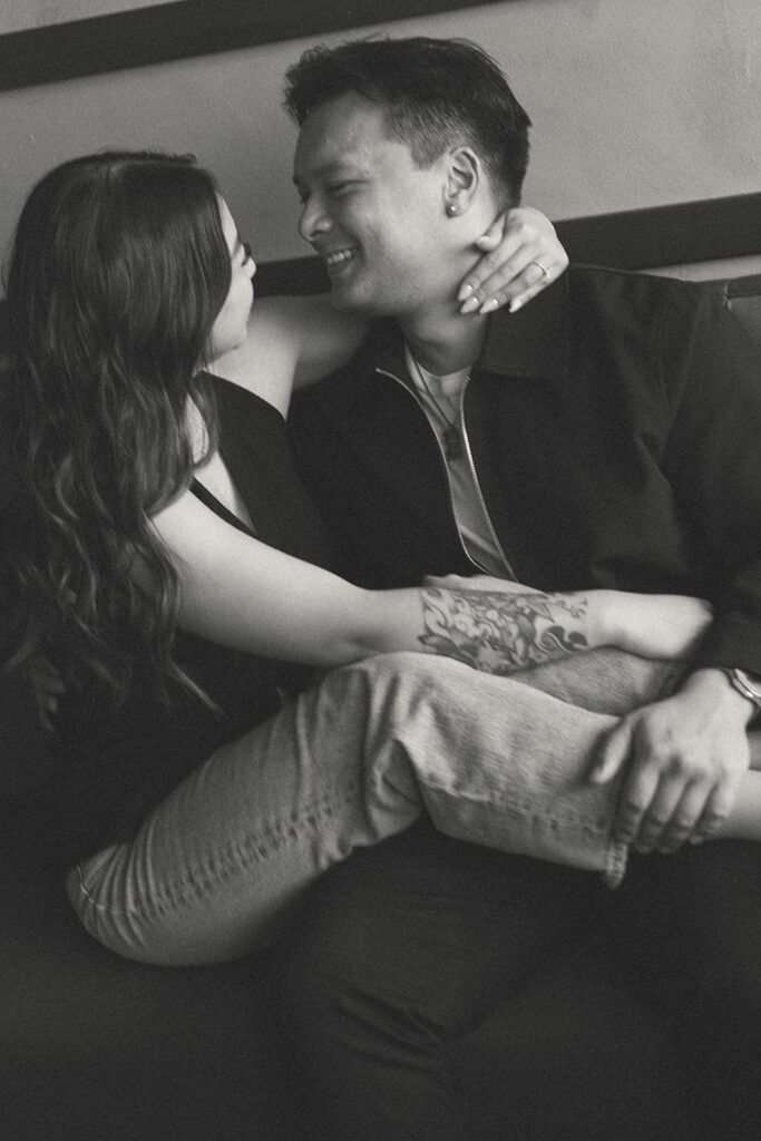 A candid moment captured during a casual engagement photo session.
