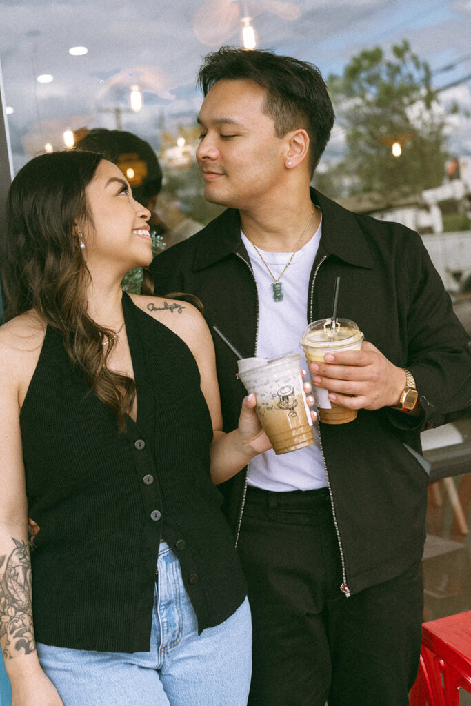 A candid moment captured during a casual engagement photo session.

