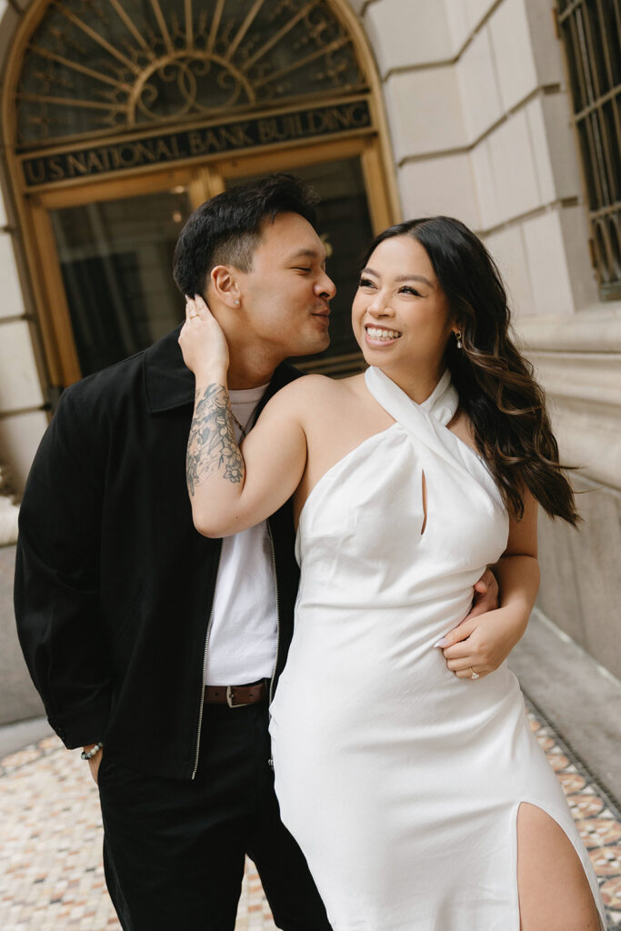 A candid moment captured during a casual engagement photo session.
