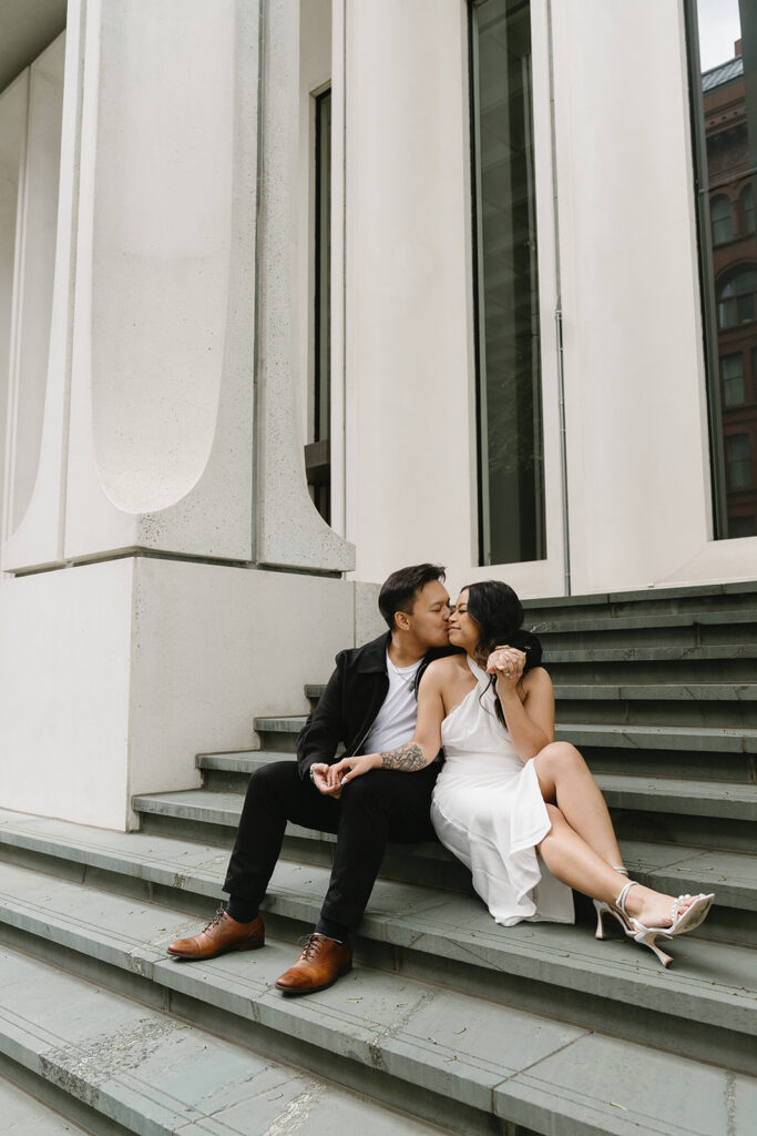 A candid moment captured during a casual engagement photo session.
