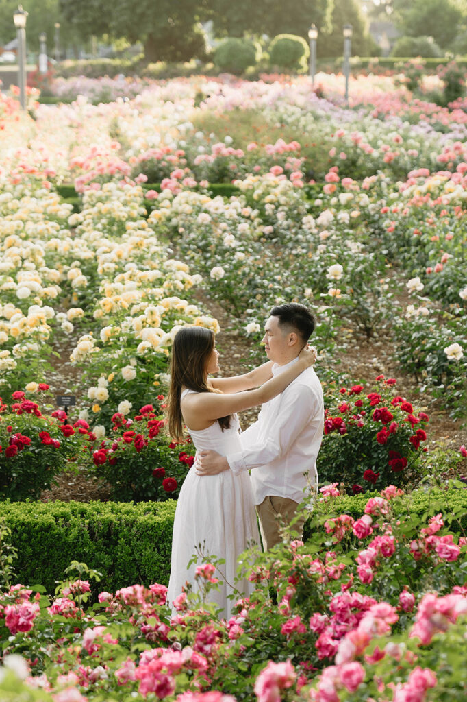 Engagement portraits captured in a Portland rose garden in full bloom.
