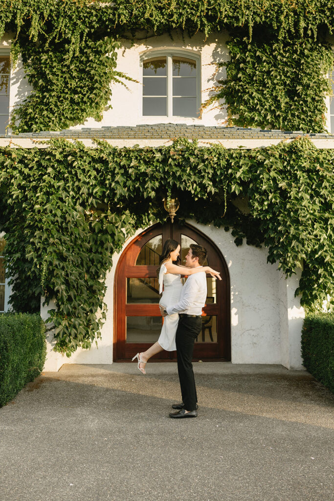 Couple walking through the gardens at during their engagement session
