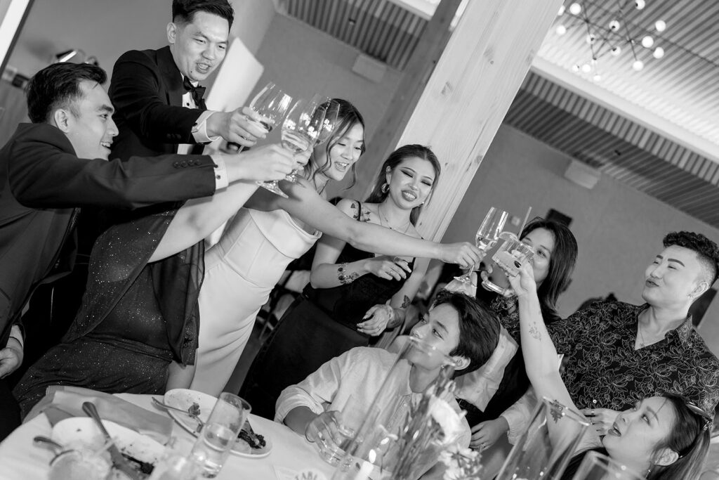 Wedding guests celebrating at Amaterra Winery surrounded by modern architecture and scenic views.
