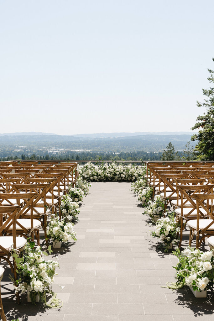 Elegant outdoor wedding ceremony setup with vineyard views in Portland, Oregon.
