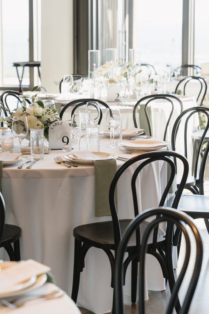 Timeless wedding reception design with neutral decor and glowing candlelight.
