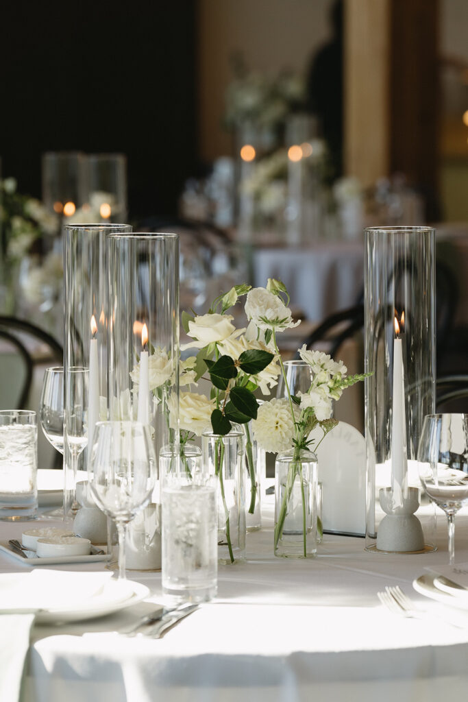Timeless wedding reception design with neutral decor and glowing candlelight.
