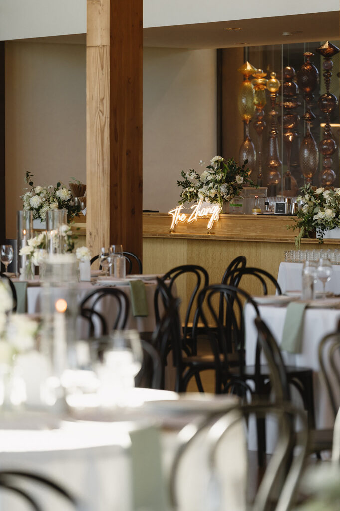 Timeless wedding reception design with neutral decor and glowing candlelight.
