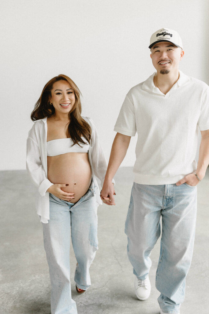 Maternity portrait featuring neutral tones and soft textures.
