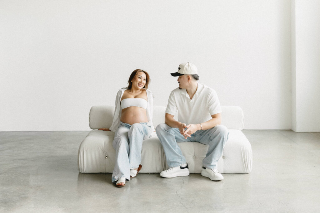 Maternity portrait featuring neutral tones and soft textures.
