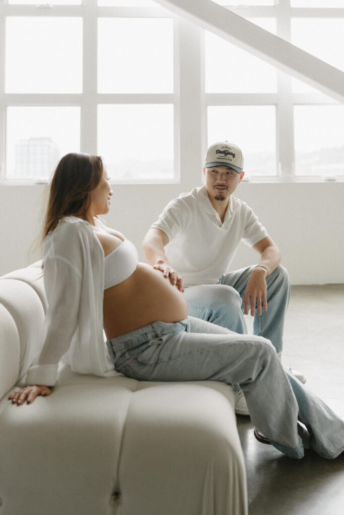 Maternity portrait featuring neutral tones and soft textures.
