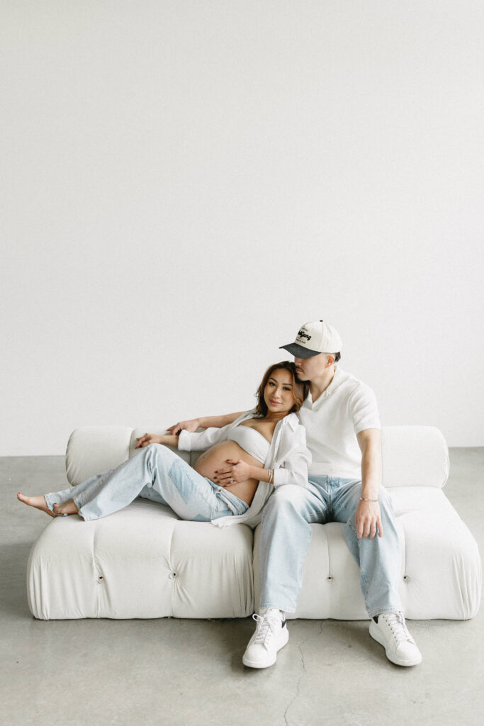 Maternity portrait featuring neutral tones and soft textures.
