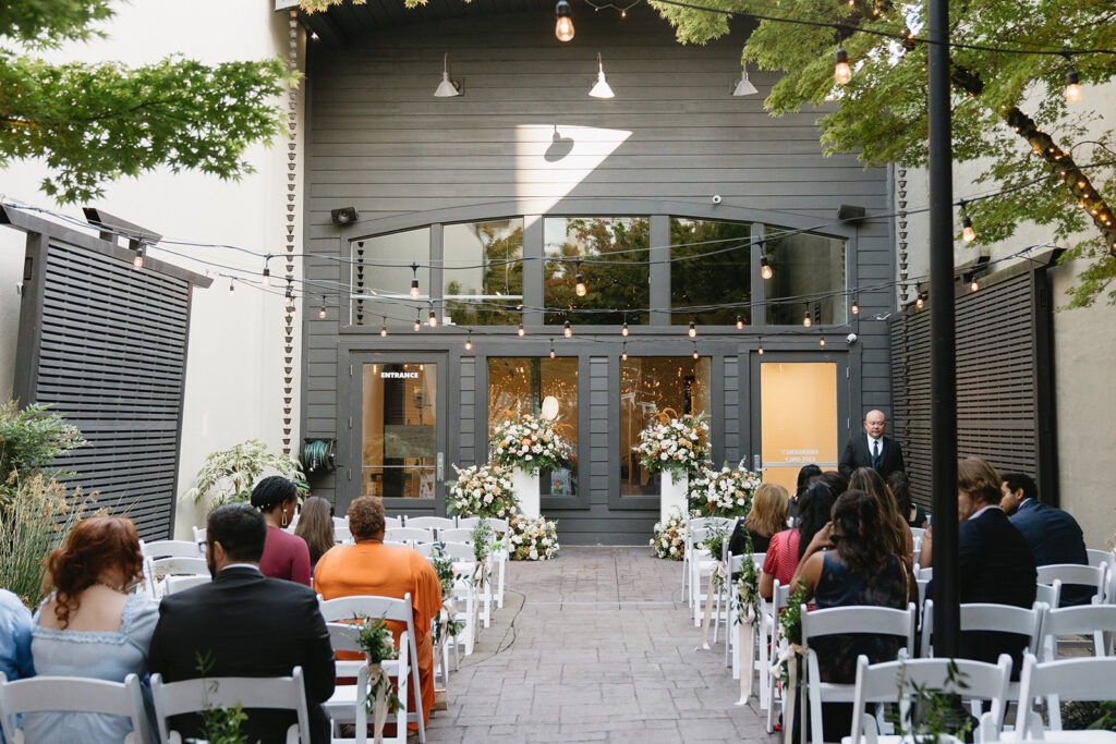 Non traditional wedding ceremony at Everett West in Portland filled with love and supportive guests
