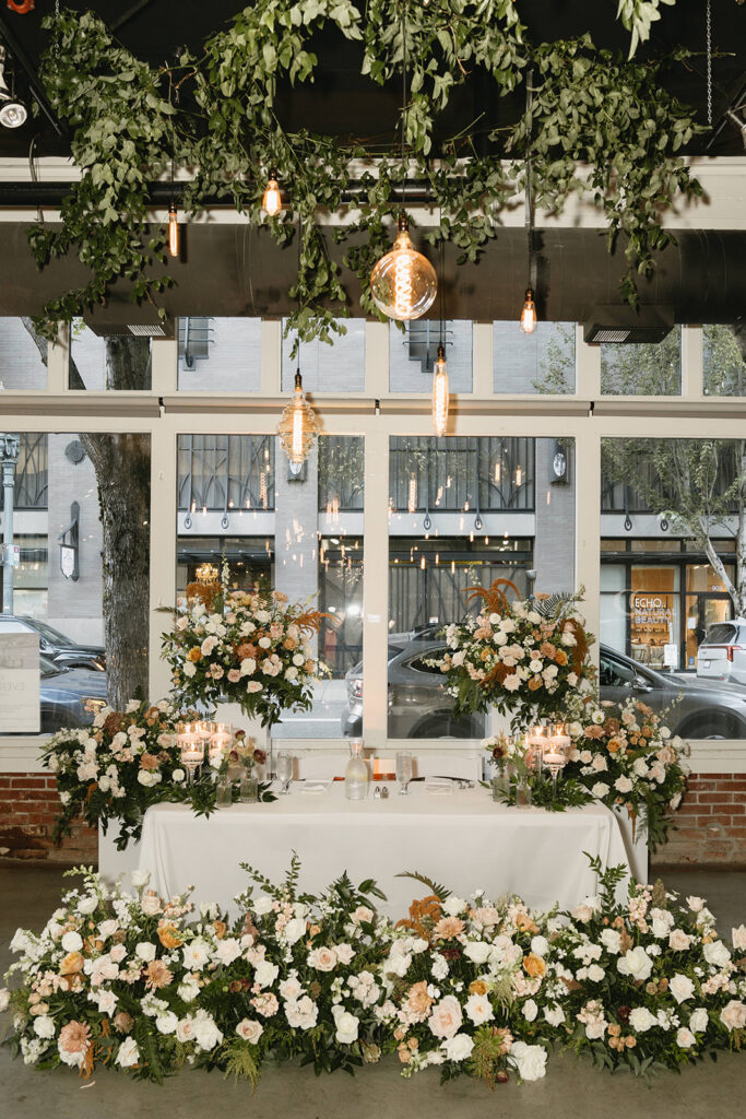 Romantic non traditional wedding reception in Portland with modern floral design
