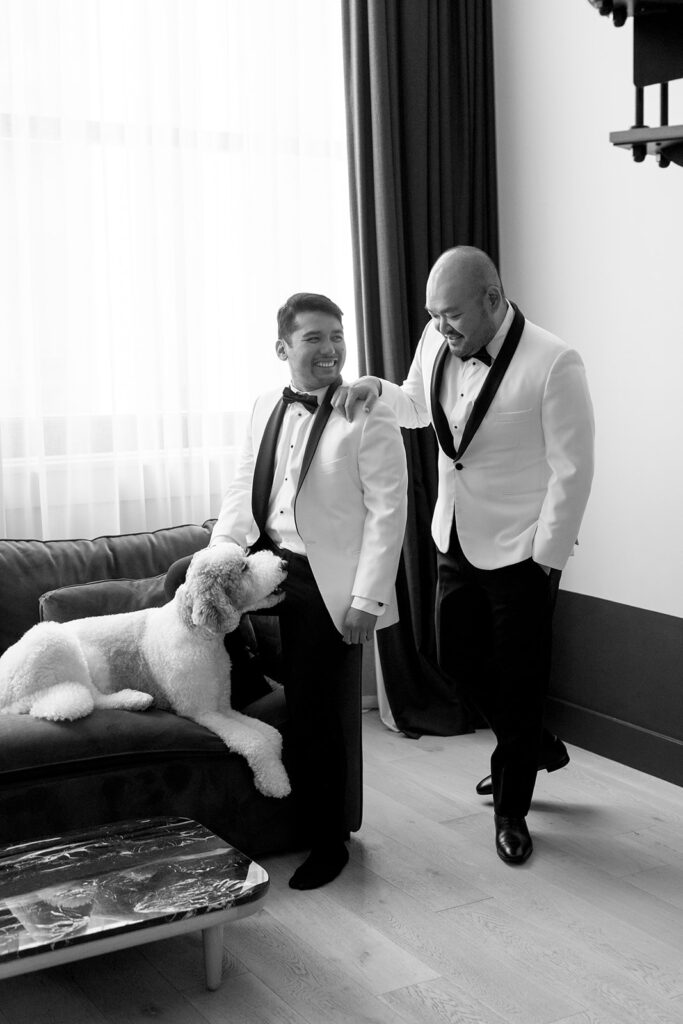 Couple getting ready together with their dog at a Portland hotel on their wedding morning
